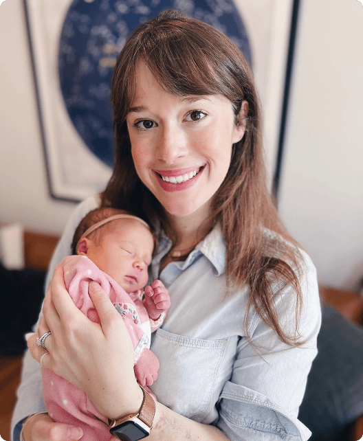 Riley CEO, Amanda DeLuca, holds her newborn baby